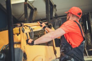 mechanic inspecting machinery