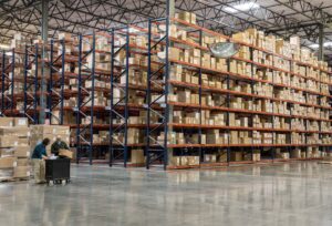 two employees checking inventory in warehouse
