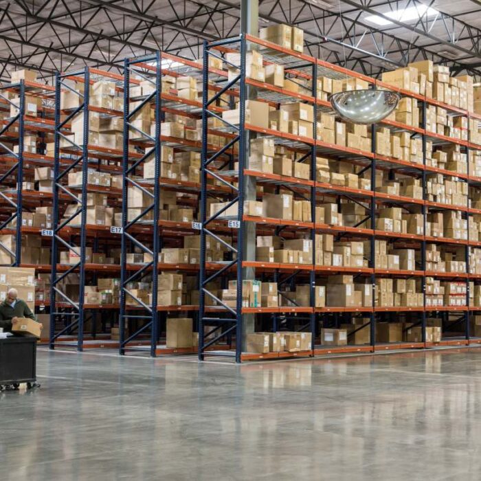 two employees checking inventory in warehouse