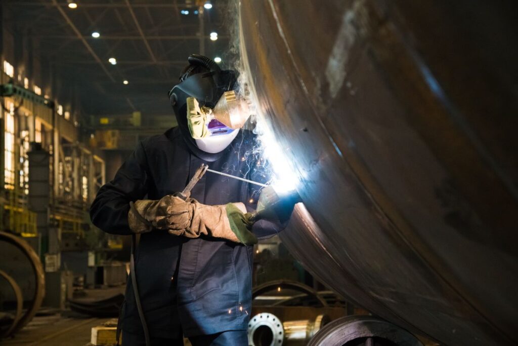 worker welding metal